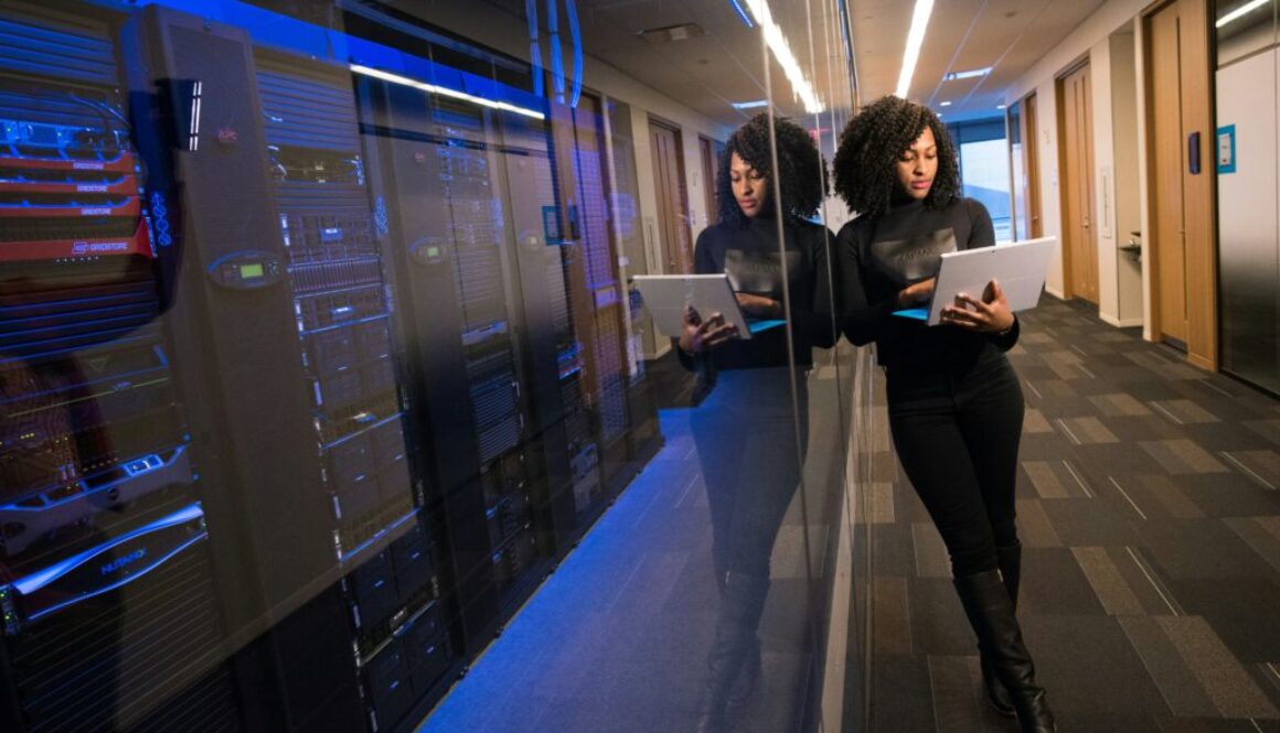 woman with laptop and server woman with laptop and server