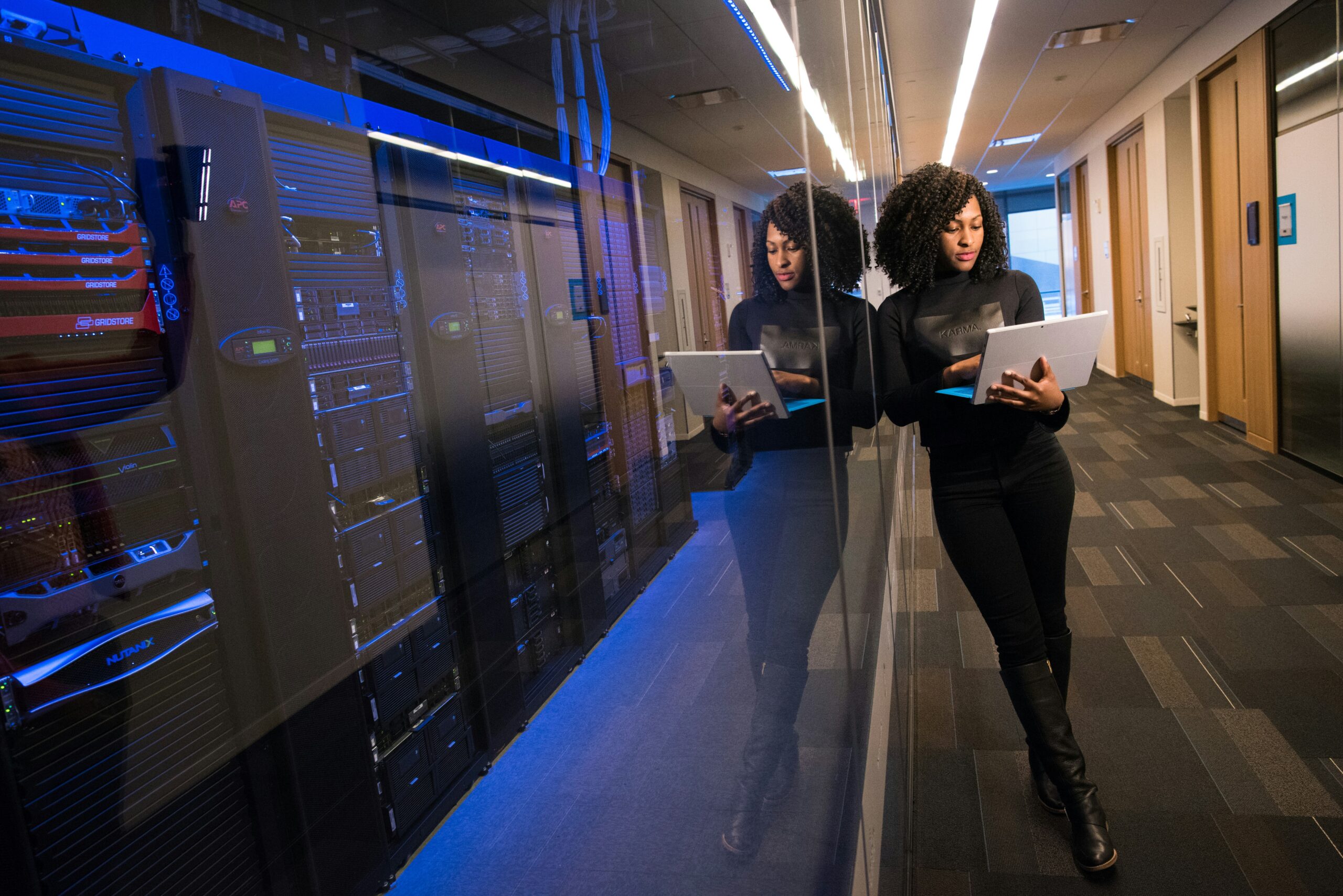 woman with laptop and server woman with laptop and server